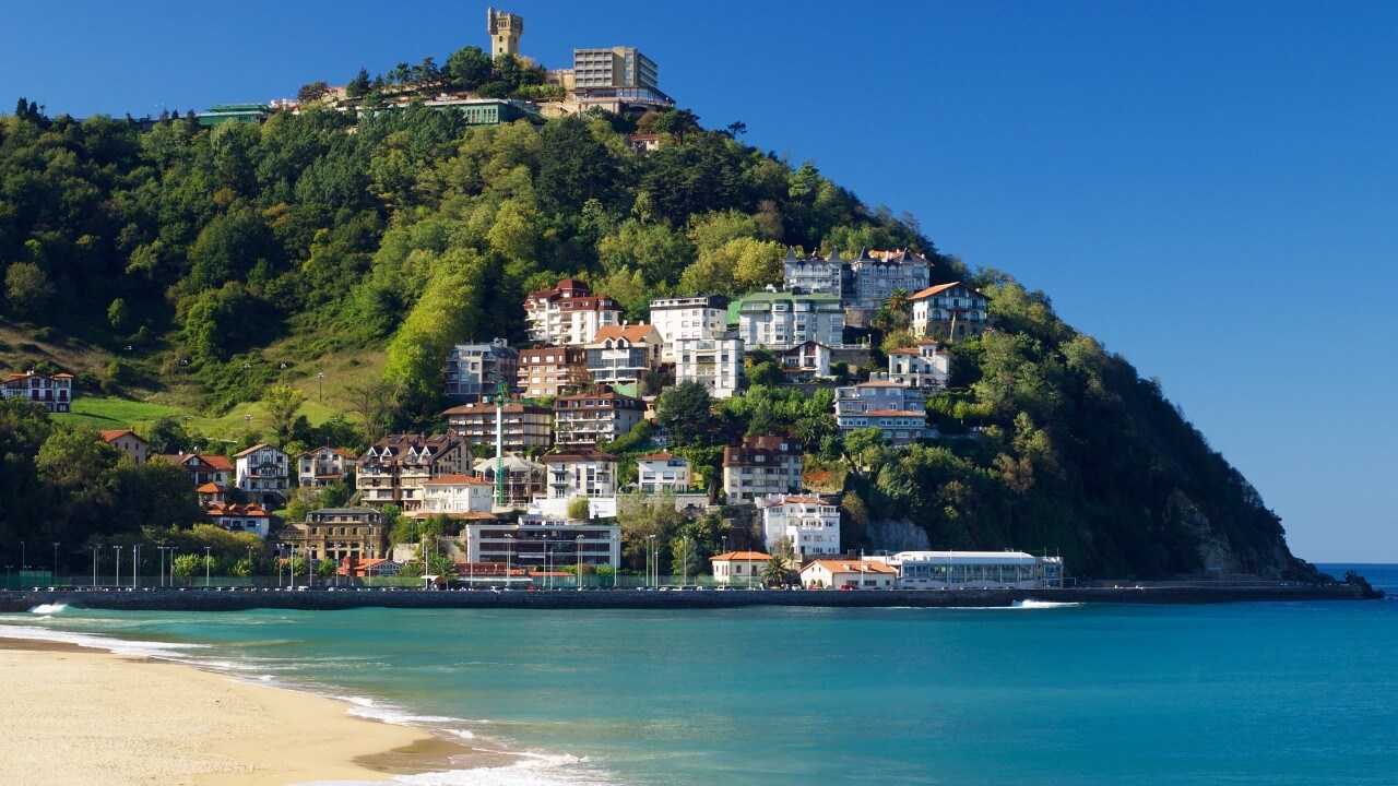 waves in Ondarreta beach, on the back Igeldo hill, San Sebastian, Guipuzcoa, Spain.